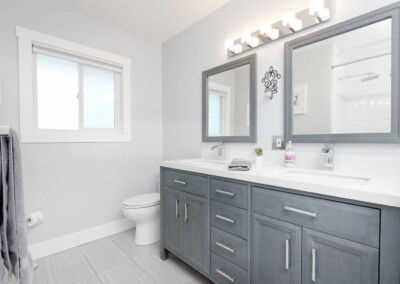 Main bathroom with double vanity at MacKenzie House, Peachland BC