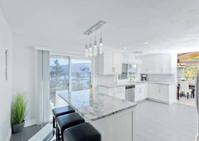 Chef's kitchen with granite breakfast bar and pendant lighting, MacKenzie House Peachland
