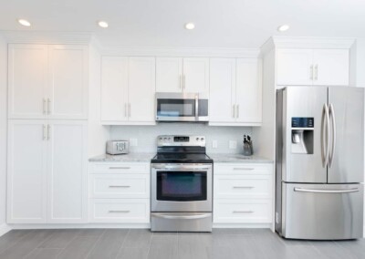 Stainless steel range, microwave and French-door fridge in the kitchen at MacKenzie House