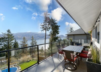 Wrap-around deck with outdoor dining and Okanagan Lake views, MacKenzie House Peachland